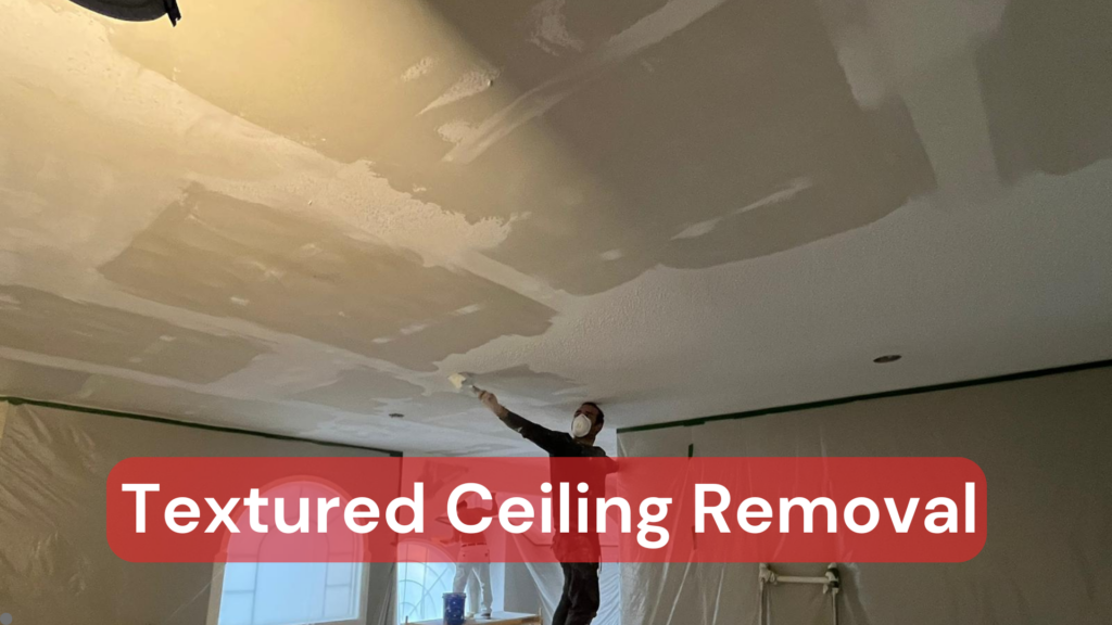 A tradesman removing a textured ceiling