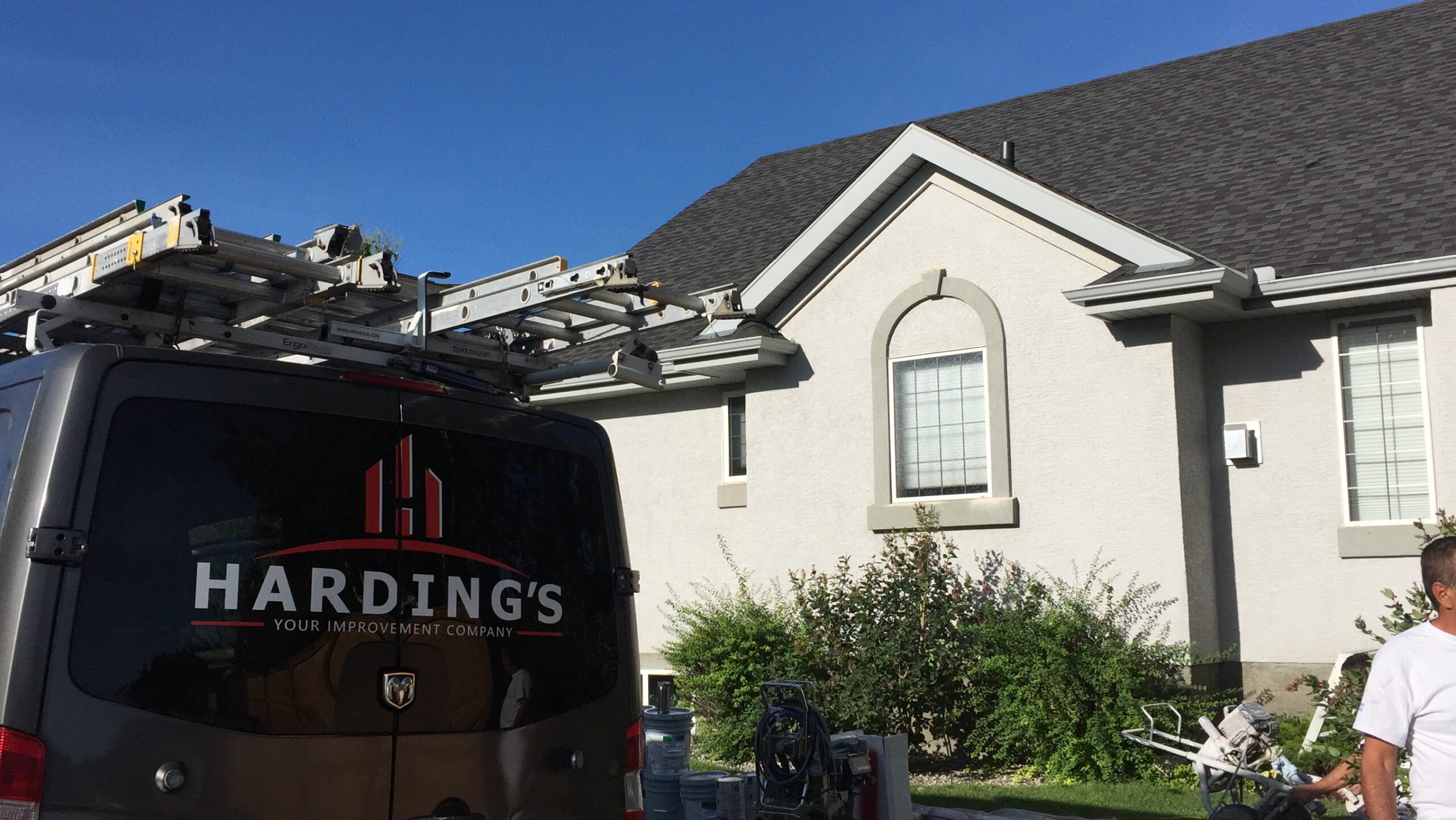 A painting truck outside a house