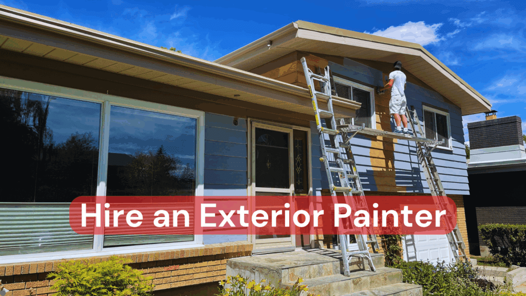 An exterior painter working on a ladder leaning against a home