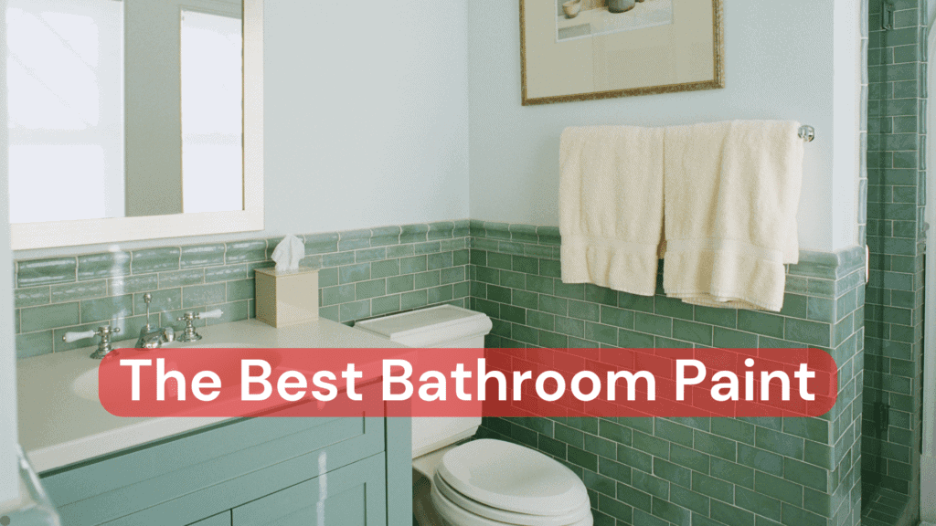 A bathroom with beautiful green tiles, a green vanity and fresh white bathroom paint