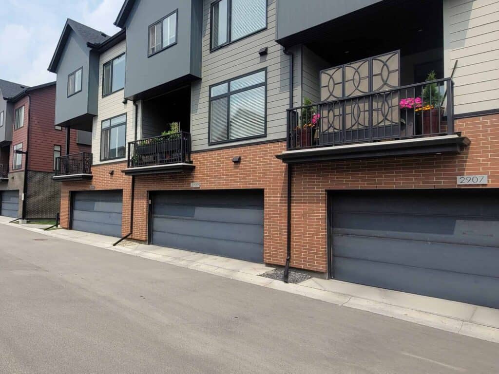another condominium project painting garage doors by Harding's Painting