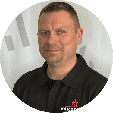 Professional portrait of Mike Condic, showcasing his expertise in residential and commercial painting, emphasizing quality workmanship and curb appeal.